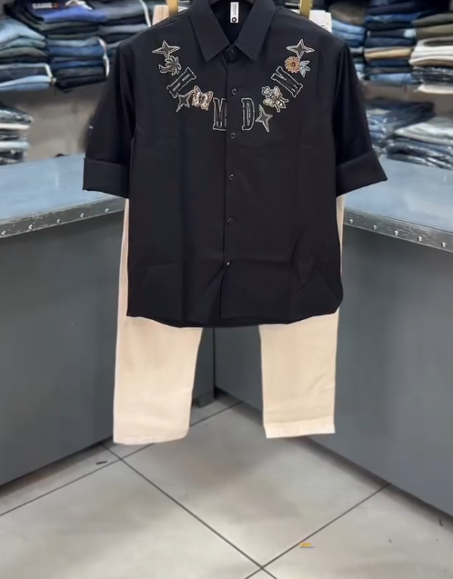 Bold & Refined: Black Men’s Embroidered Party Shirt with Light-Colored Baggy Jeans