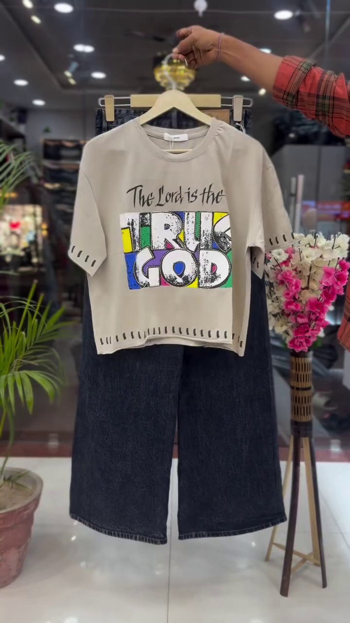 Urban Edge: Hot Pink Graphic T-Shirt with Wide-Leg Black Denim Jeans