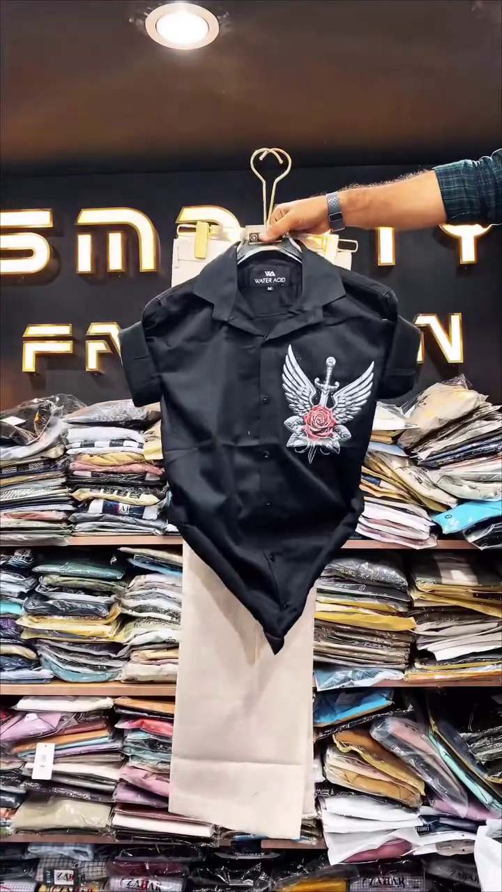 Chic & Modern: White Short-Sleeve Shirt with Black Graphic and Trousers