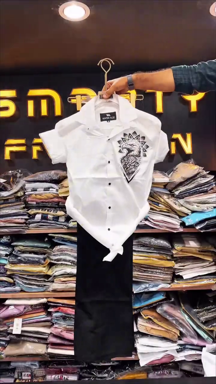 Chic & Modern: White Short-Sleeve Shirt with Black Graphic and Trousers