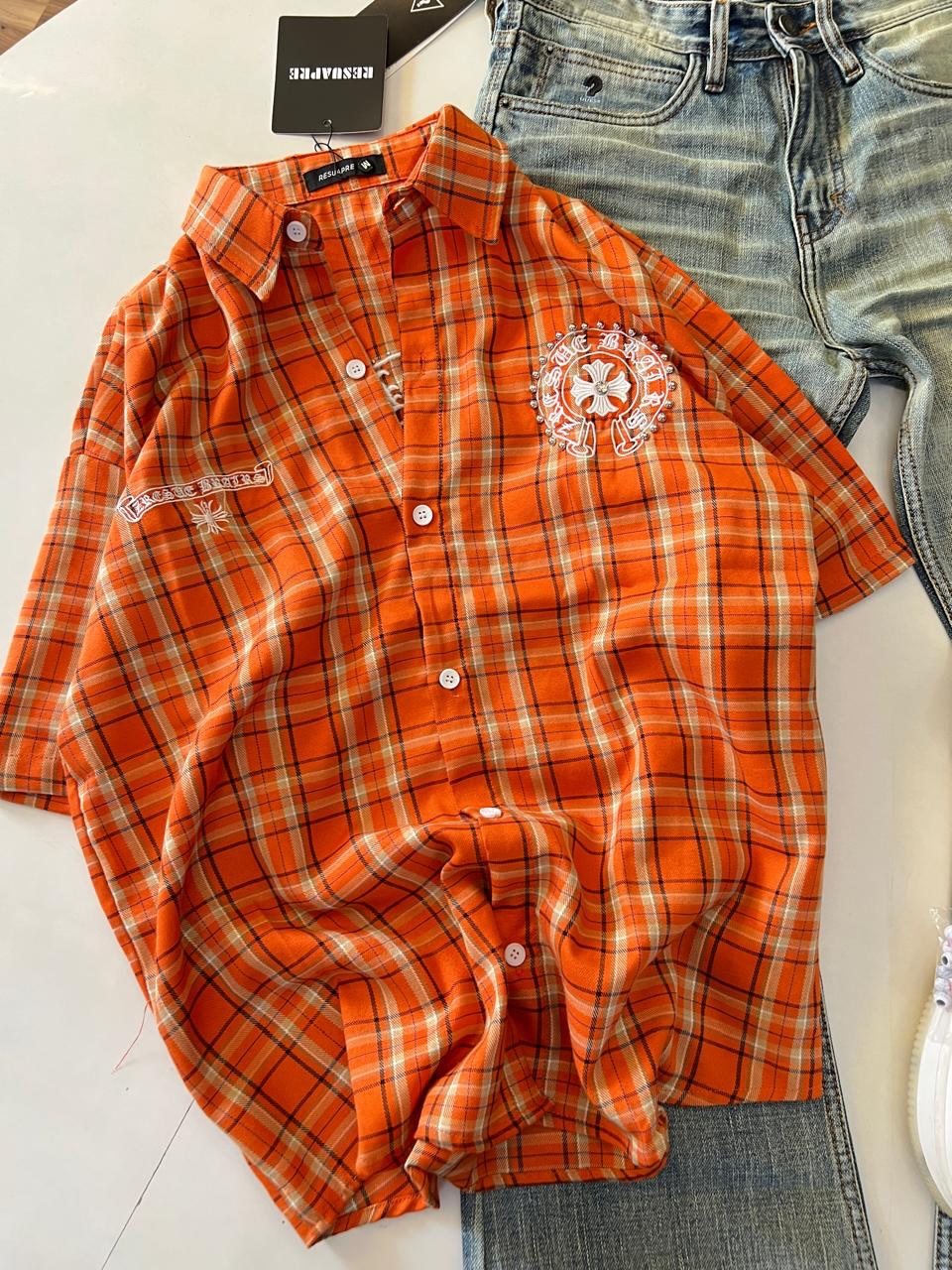 Casual Street-Style: Men’s Orange Plaid Shirt with Distressed Jeans & White Sneakers