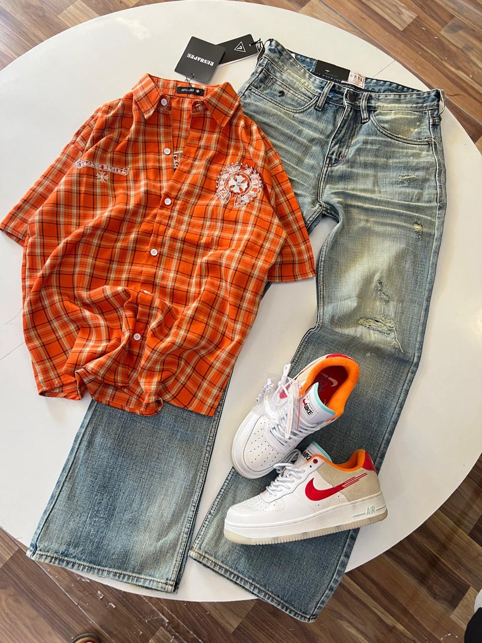 Casual Street-Style: Men’s Orange Plaid Shirt with Distressed Jeans & White Sneakers