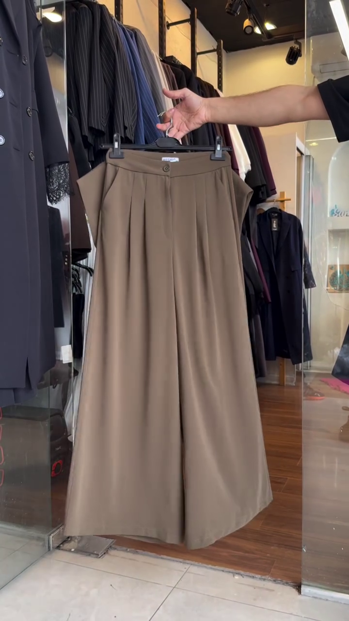Powerfully Elegant: Chic Brown Pantsuit with Asymmetrical Sleeveless Vest and Wide-Leg Trousers